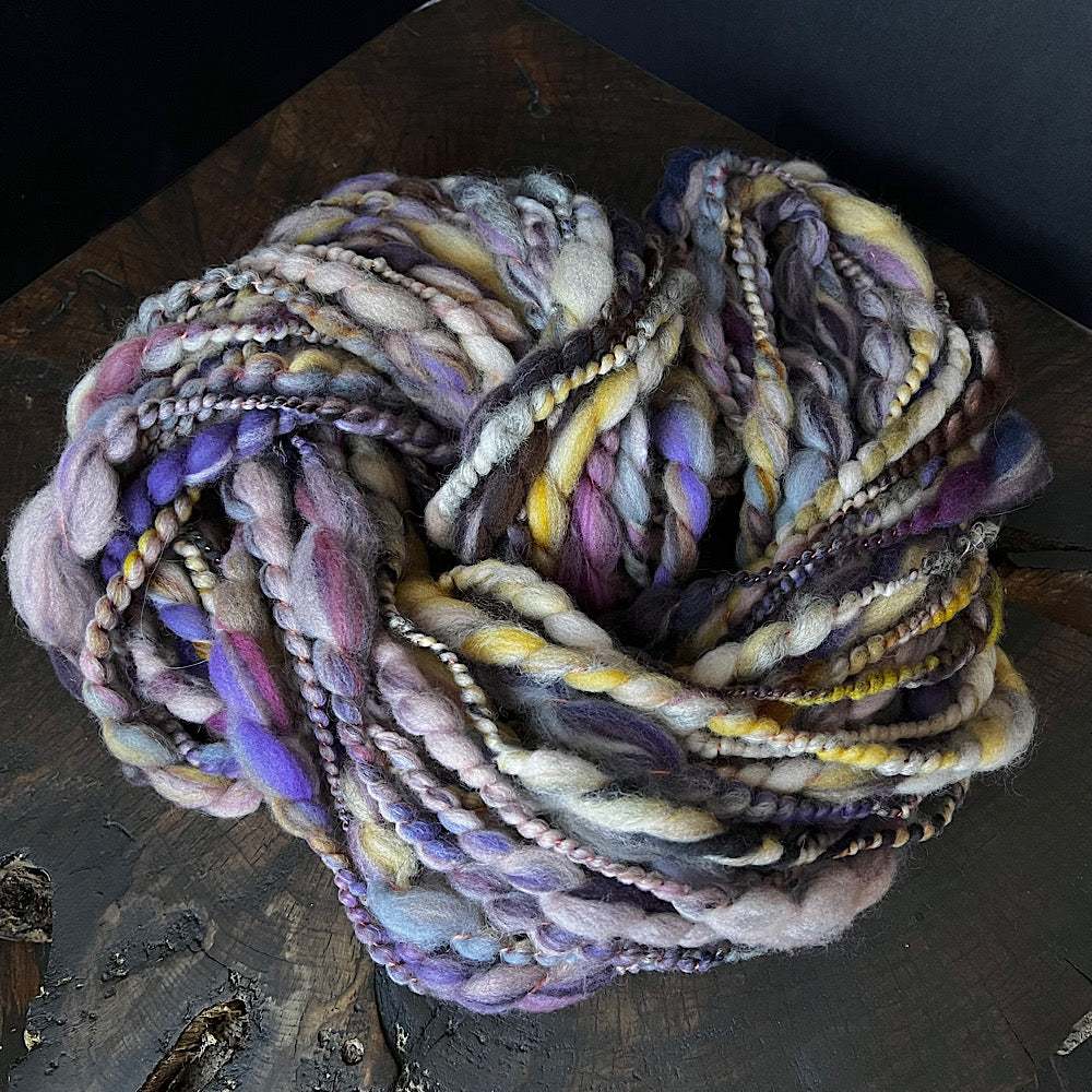 Hand spun spiral yarn for weaving and knitting