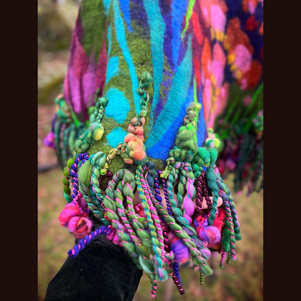 Felted cape with woven collar