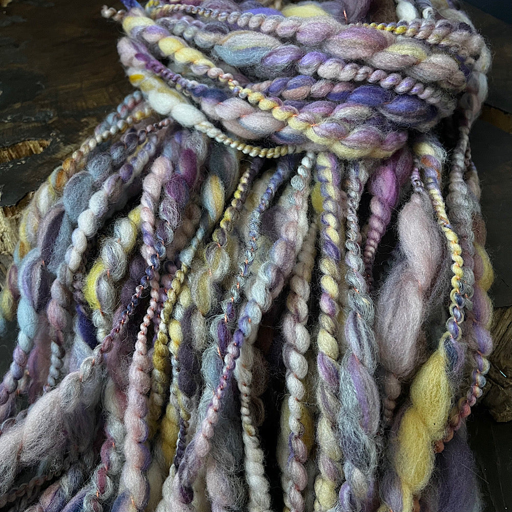 Hand spun spiral yarn for weaving and knitting