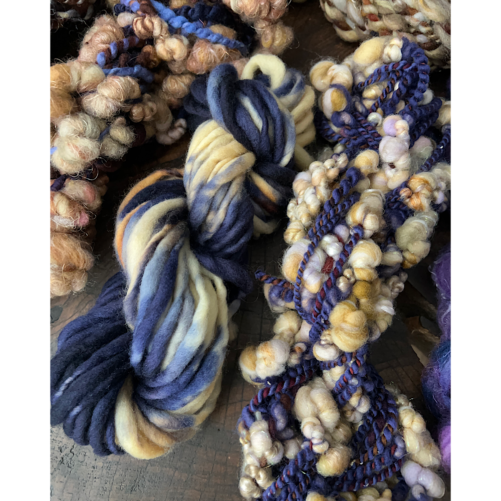 Large assortment of art yarns for weavers and knitters