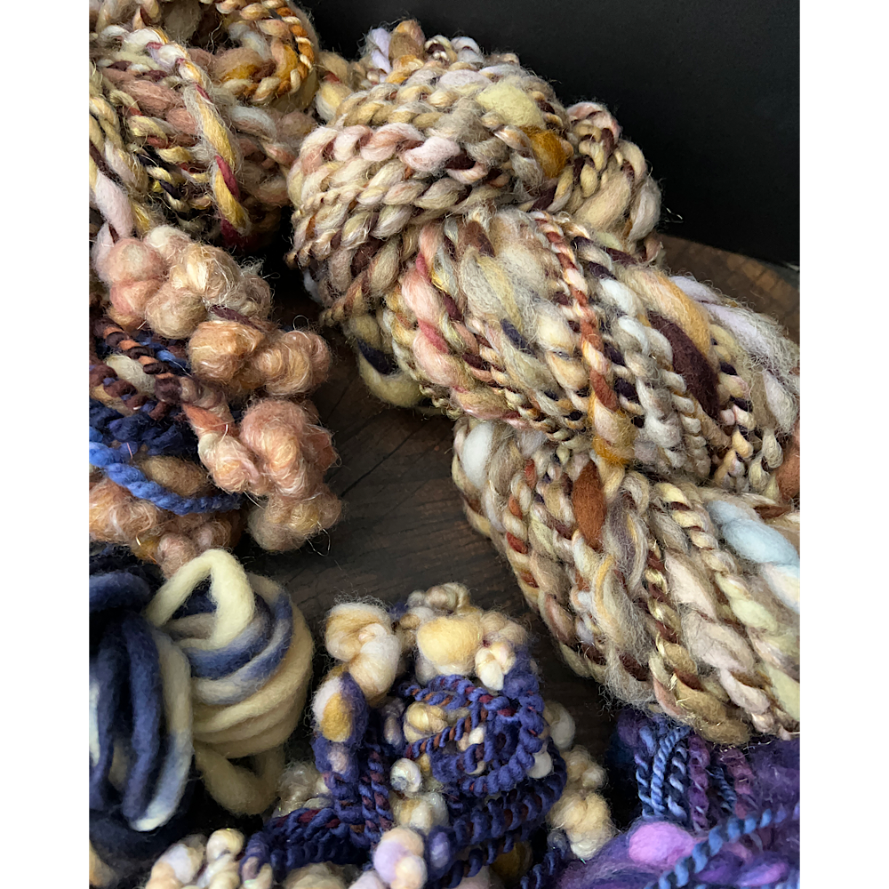 Large assortment of art yarns for weavers and knitters