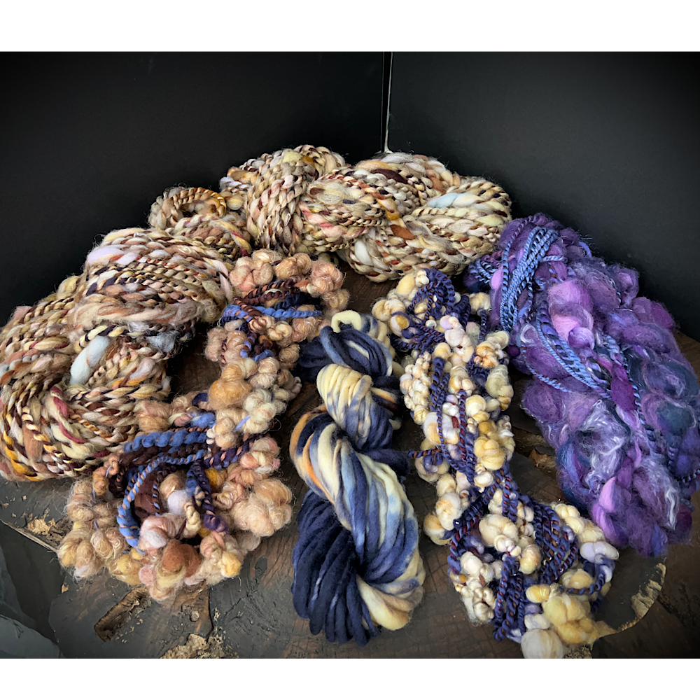 Large assortment of art yarns for weavers and knitters