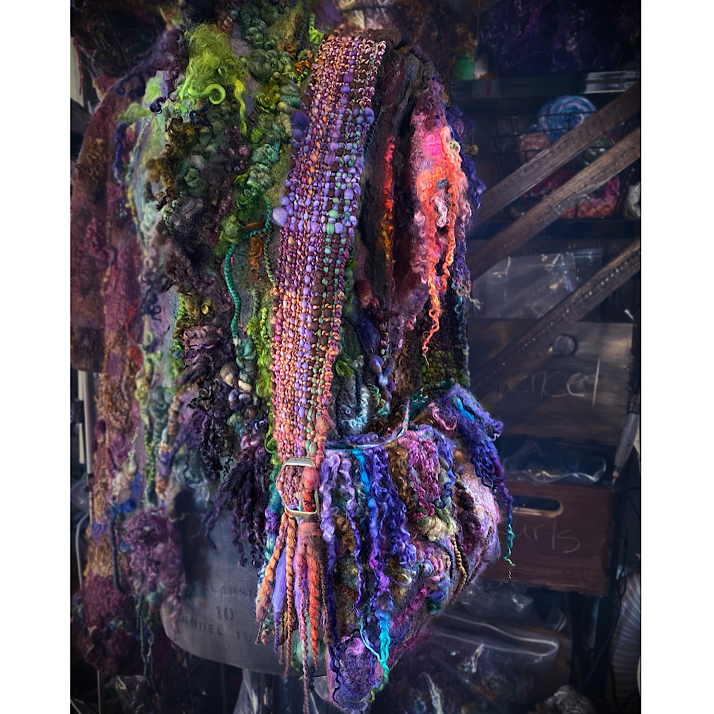 Felted bag with woven strap