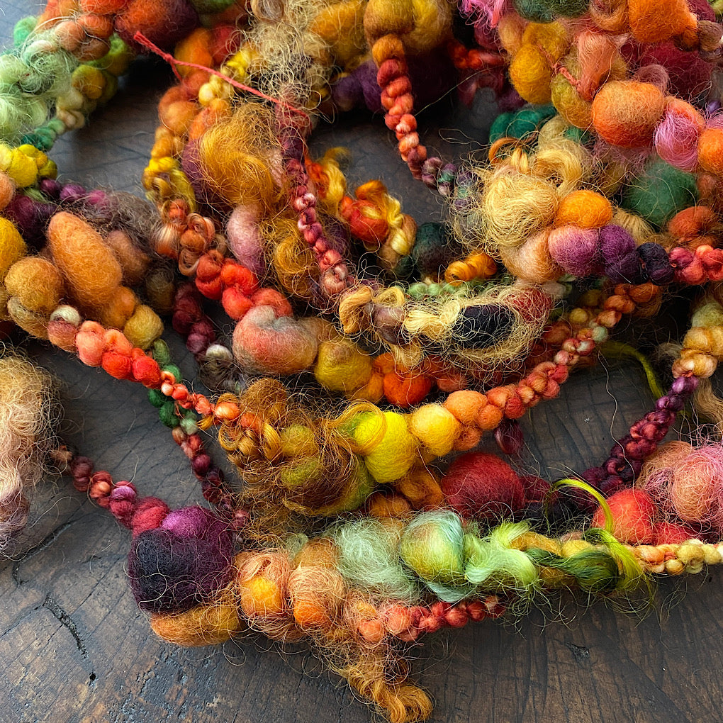 Cornucopia boucle art yarn with locks