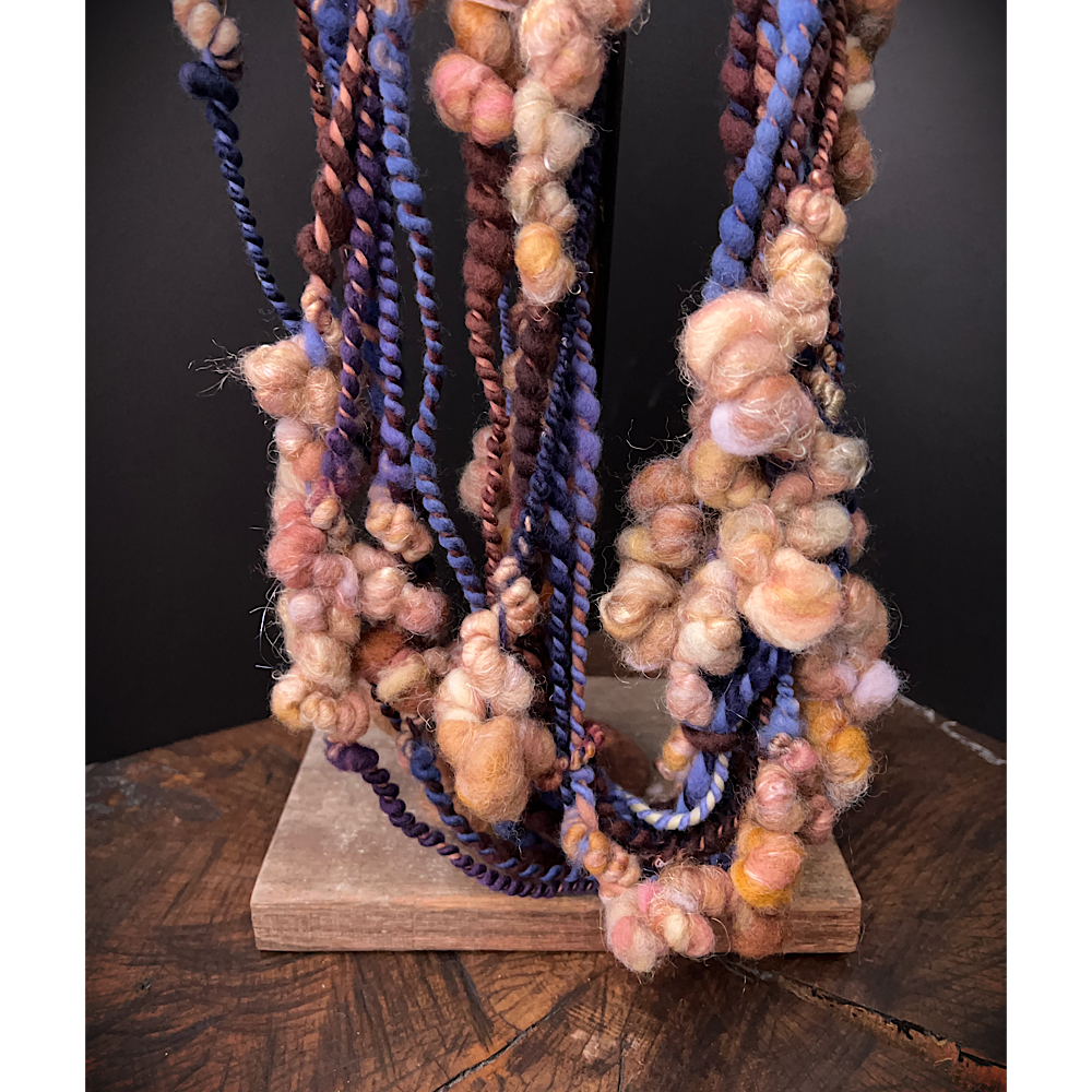 Large assortment of art yarns for weavers and knitters