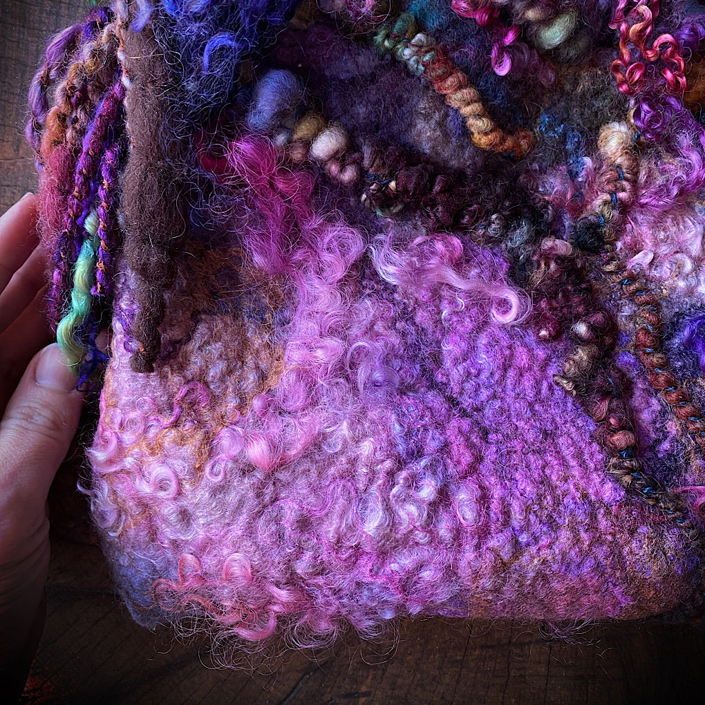 Felted bag with woven strap