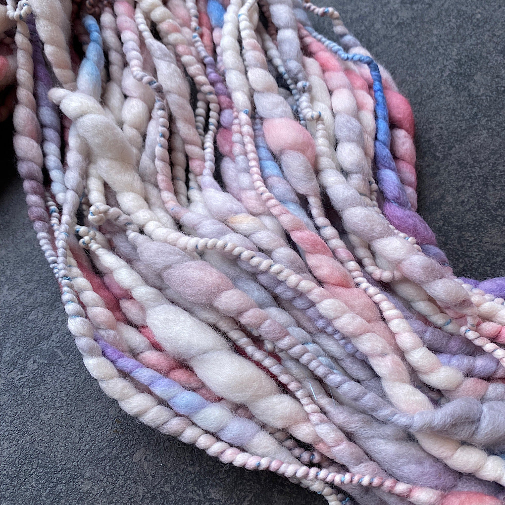 Snow is blushing merino spiral handspun yarn