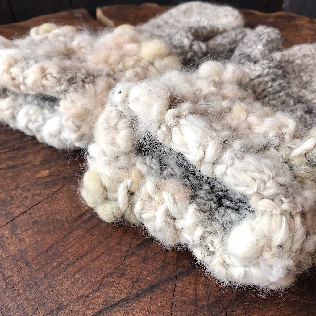 Grey knitted mittens