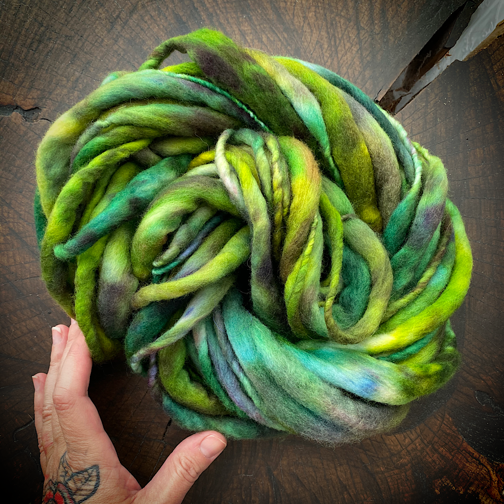 Green thick and thin merino knitting yarn