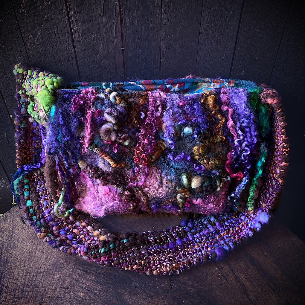 Felted bag with woven strap