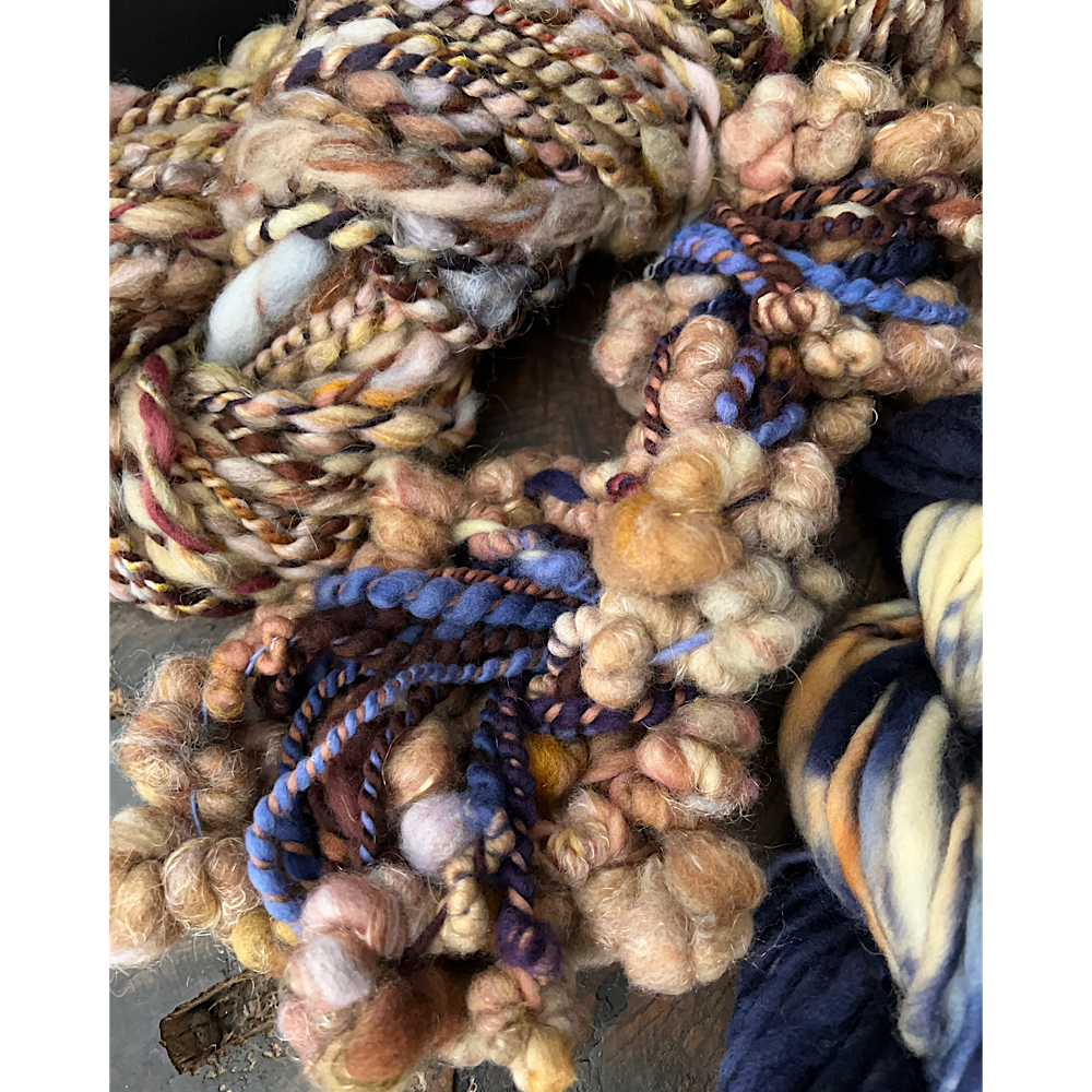 Large assortment of art yarns for weavers and knitters