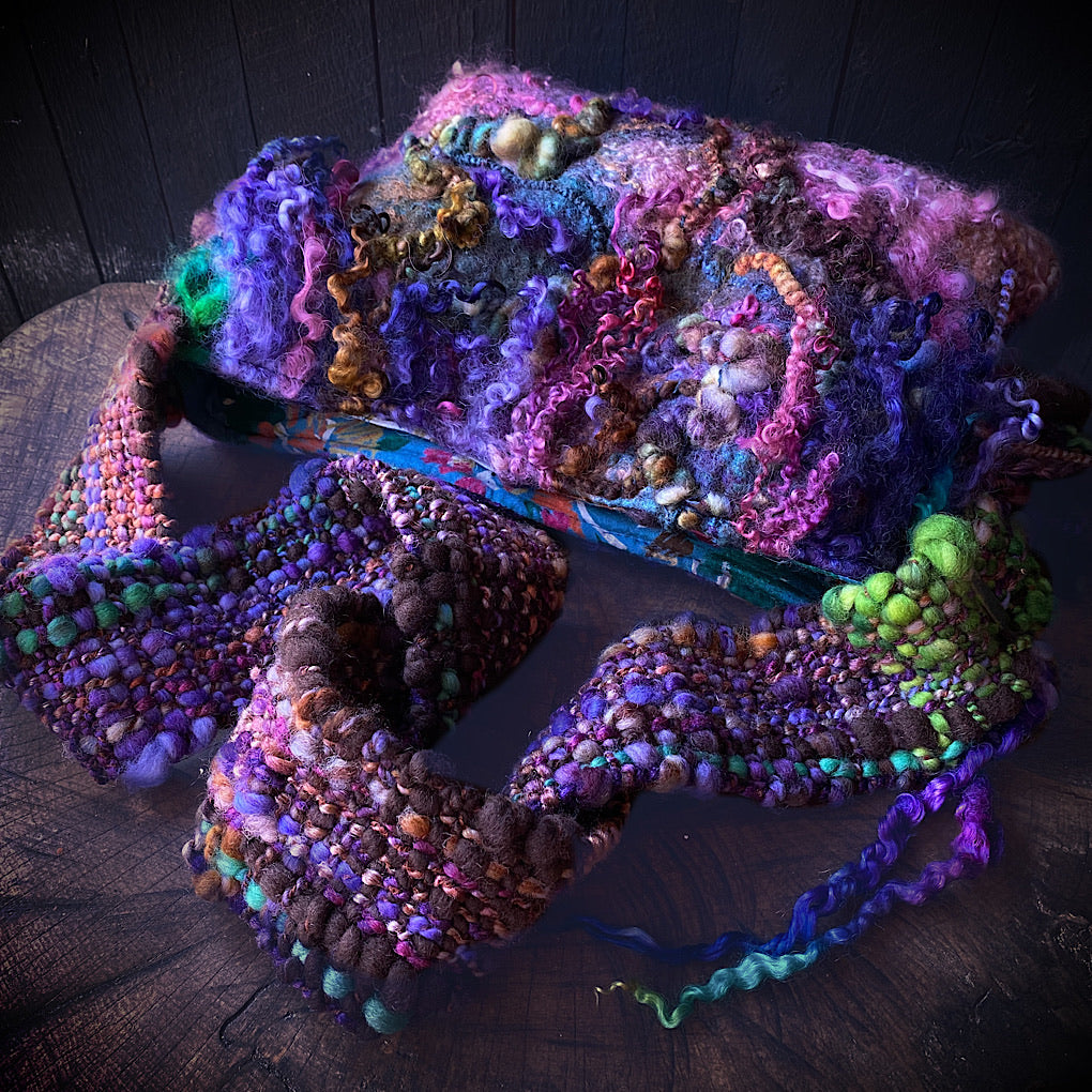 Felted bag with woven strap