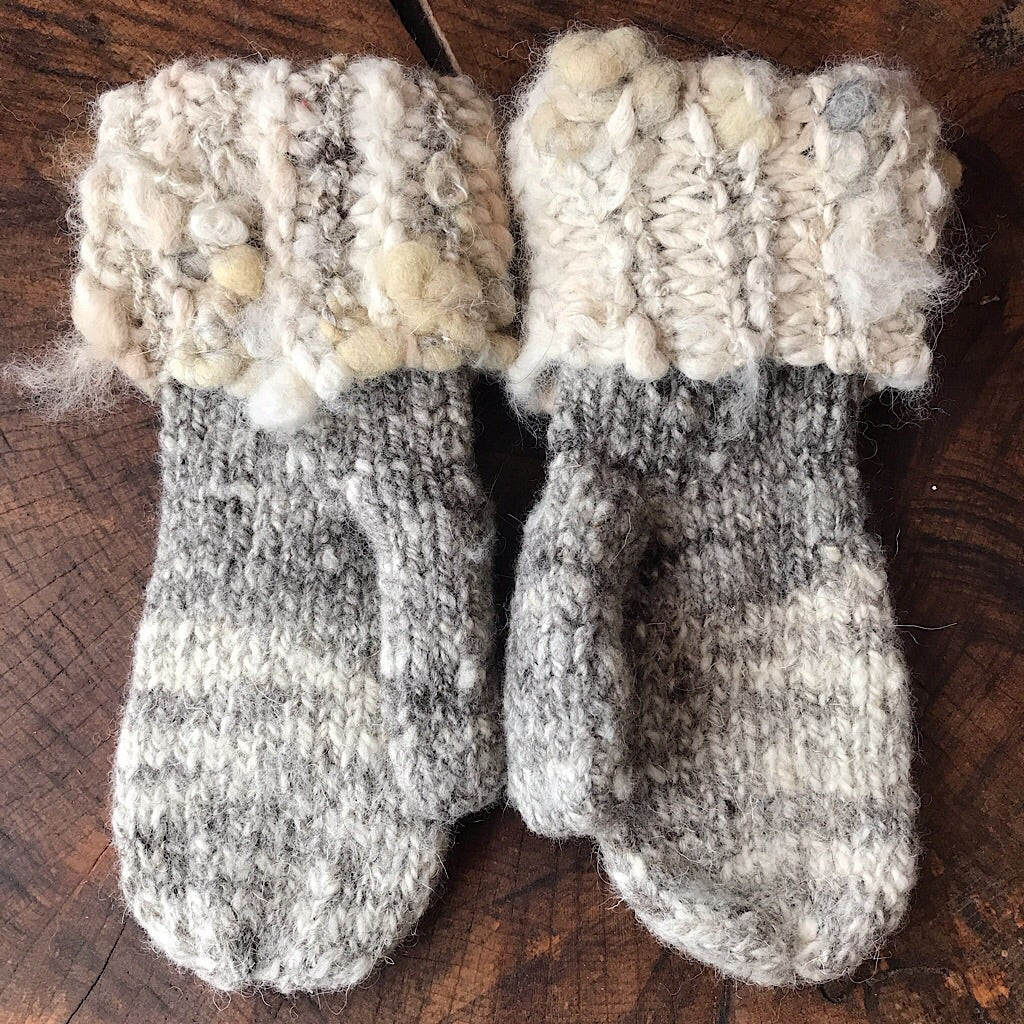 Grey knitted mittens