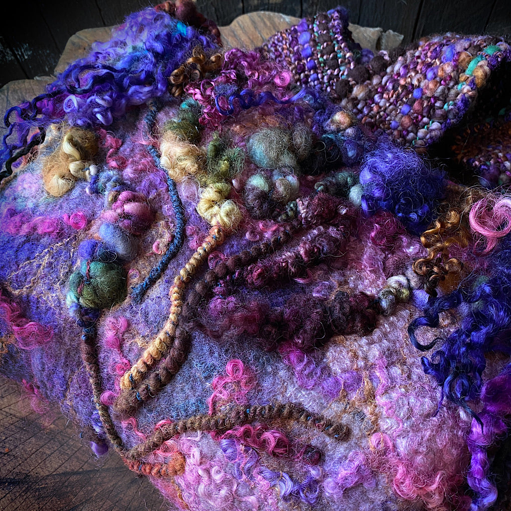 Felted bag with woven strap