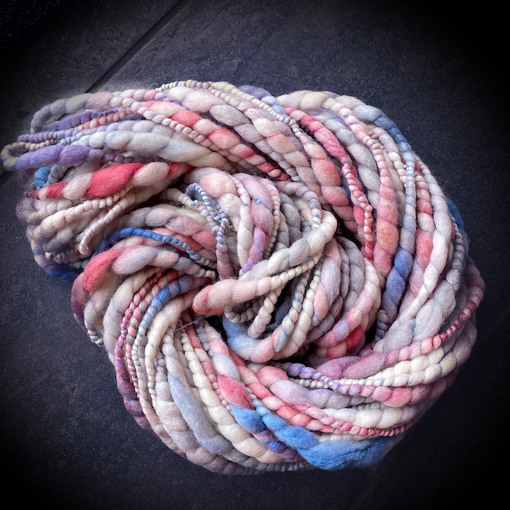 Snow is blushing merino spiral handspun yarn