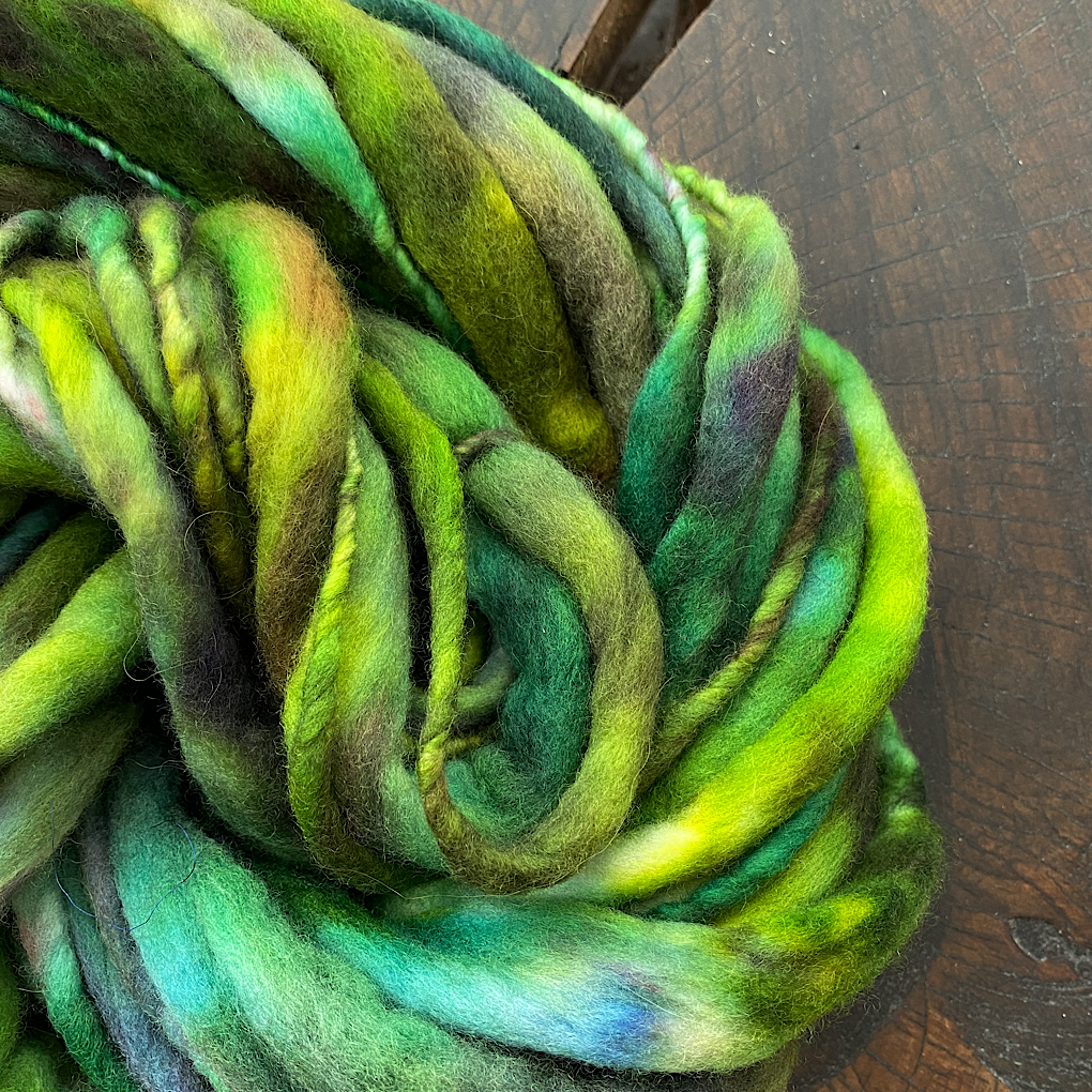 Green thick and thin merino knitting yarn