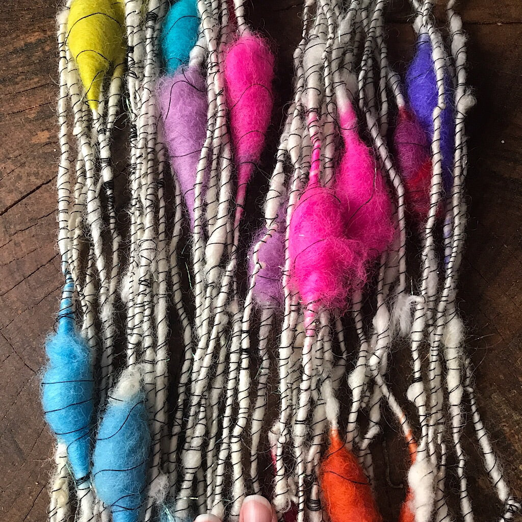 Rainbow cocoons Art yarn