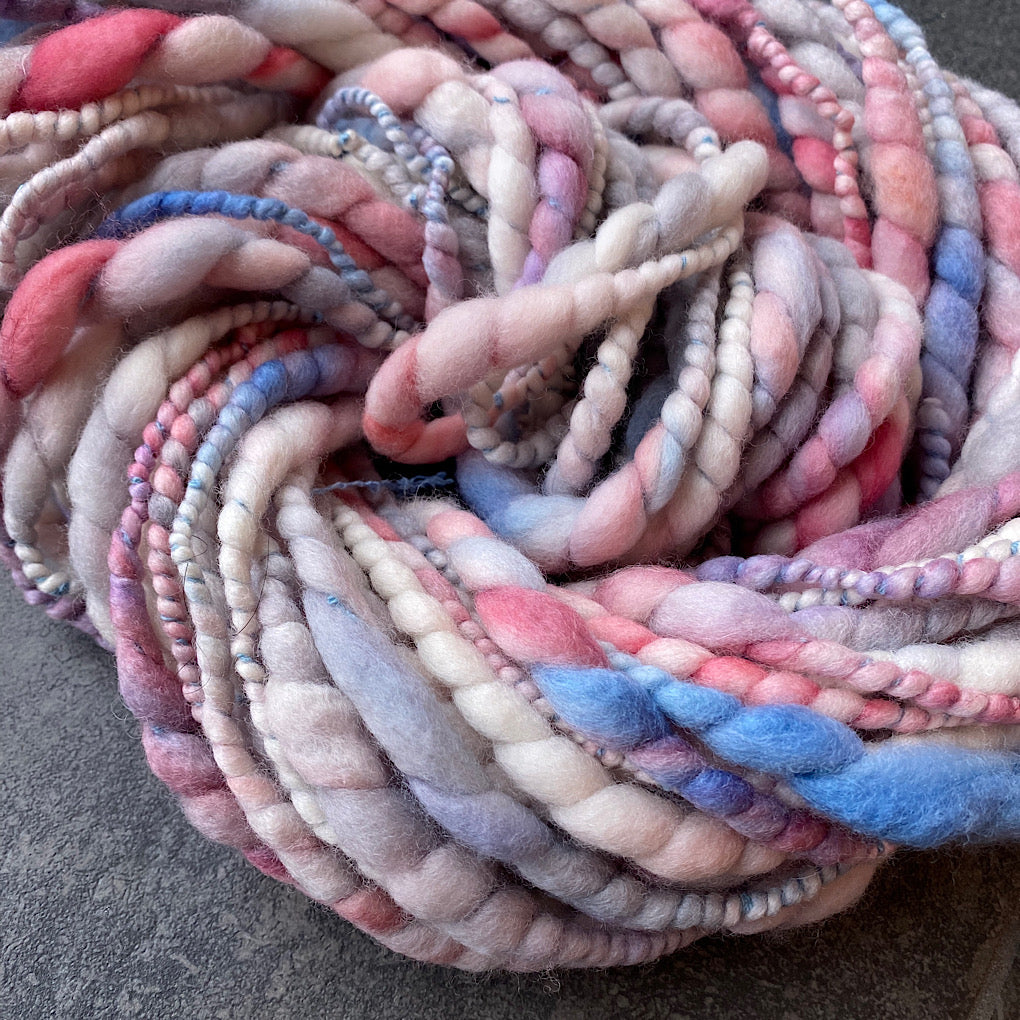 Snow is blushing merino spiral handspun yarn