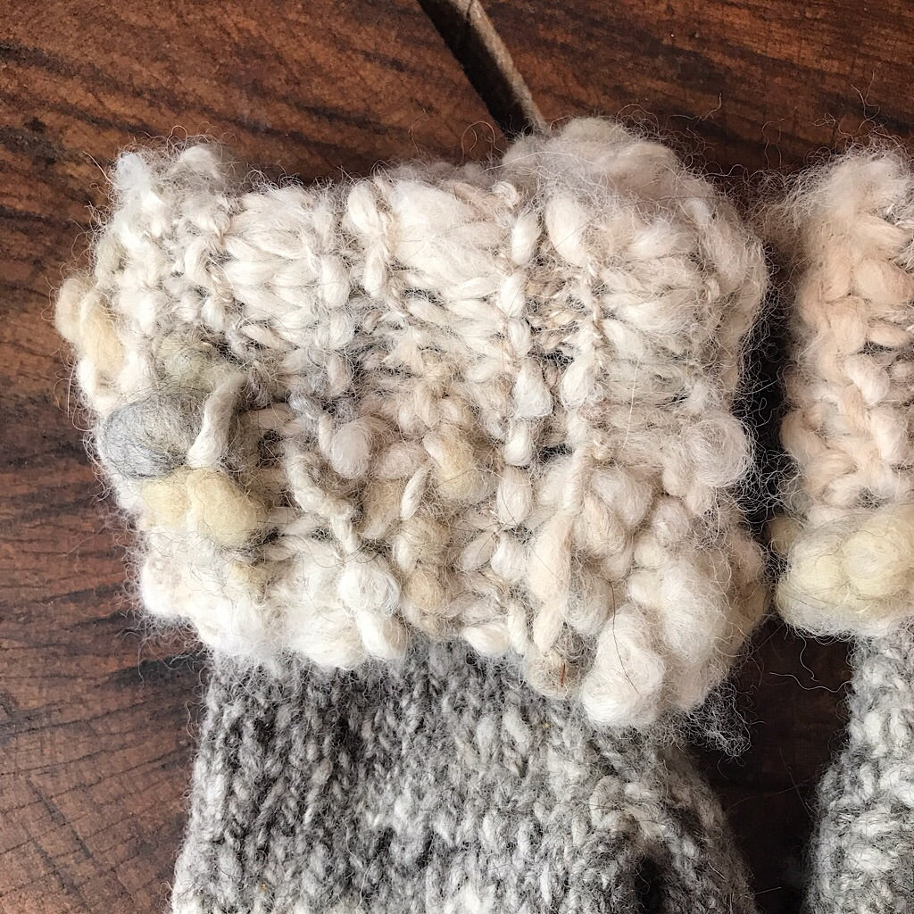 Grey knitted mittens