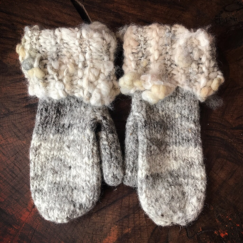 Grey knitted mittens