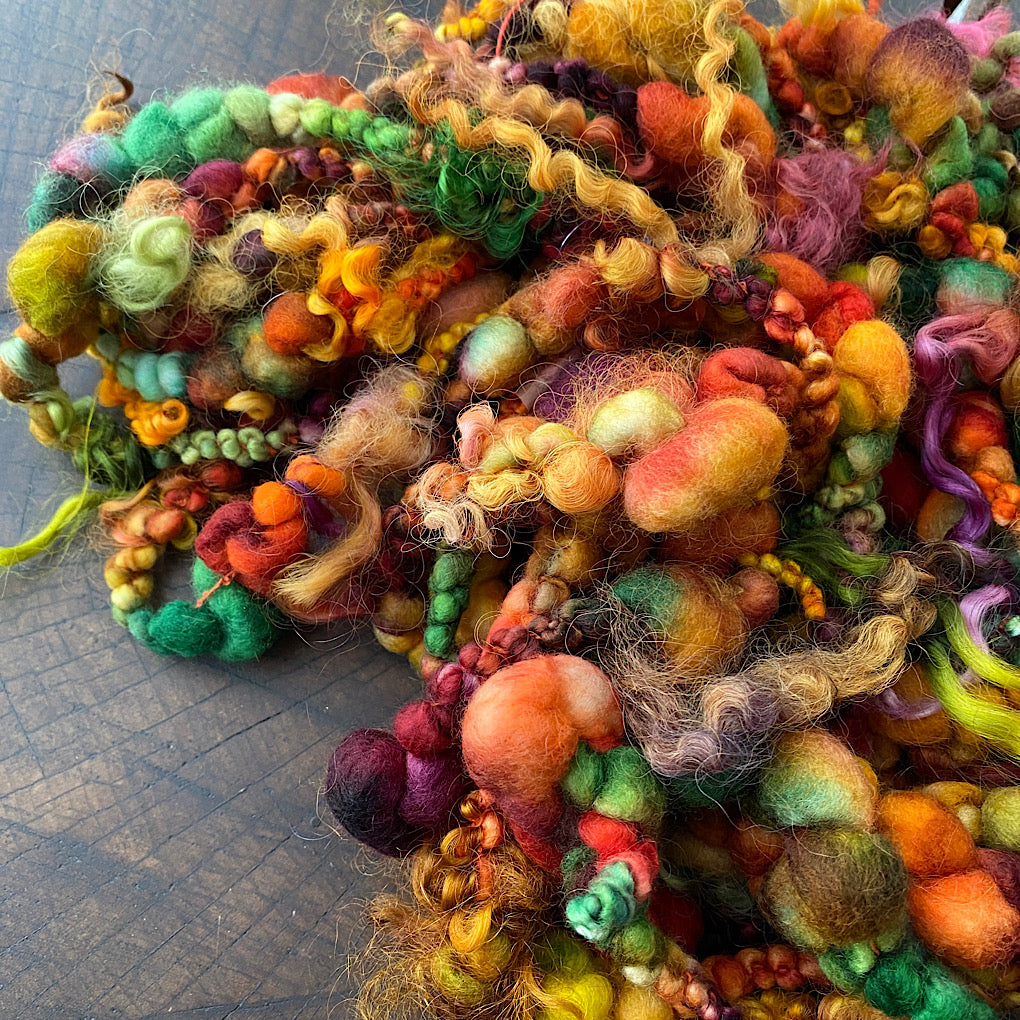 Cornucopia boucle art yarn with locks