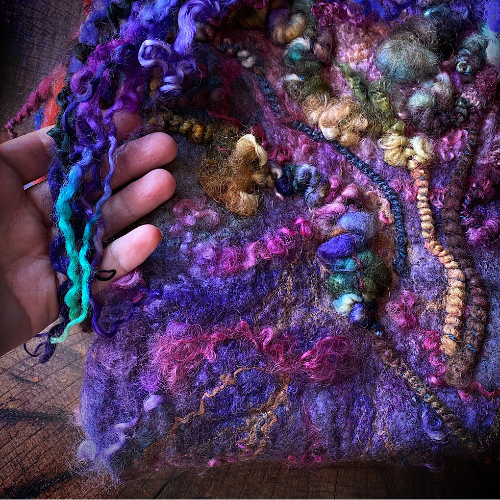 Felted bag with woven strap